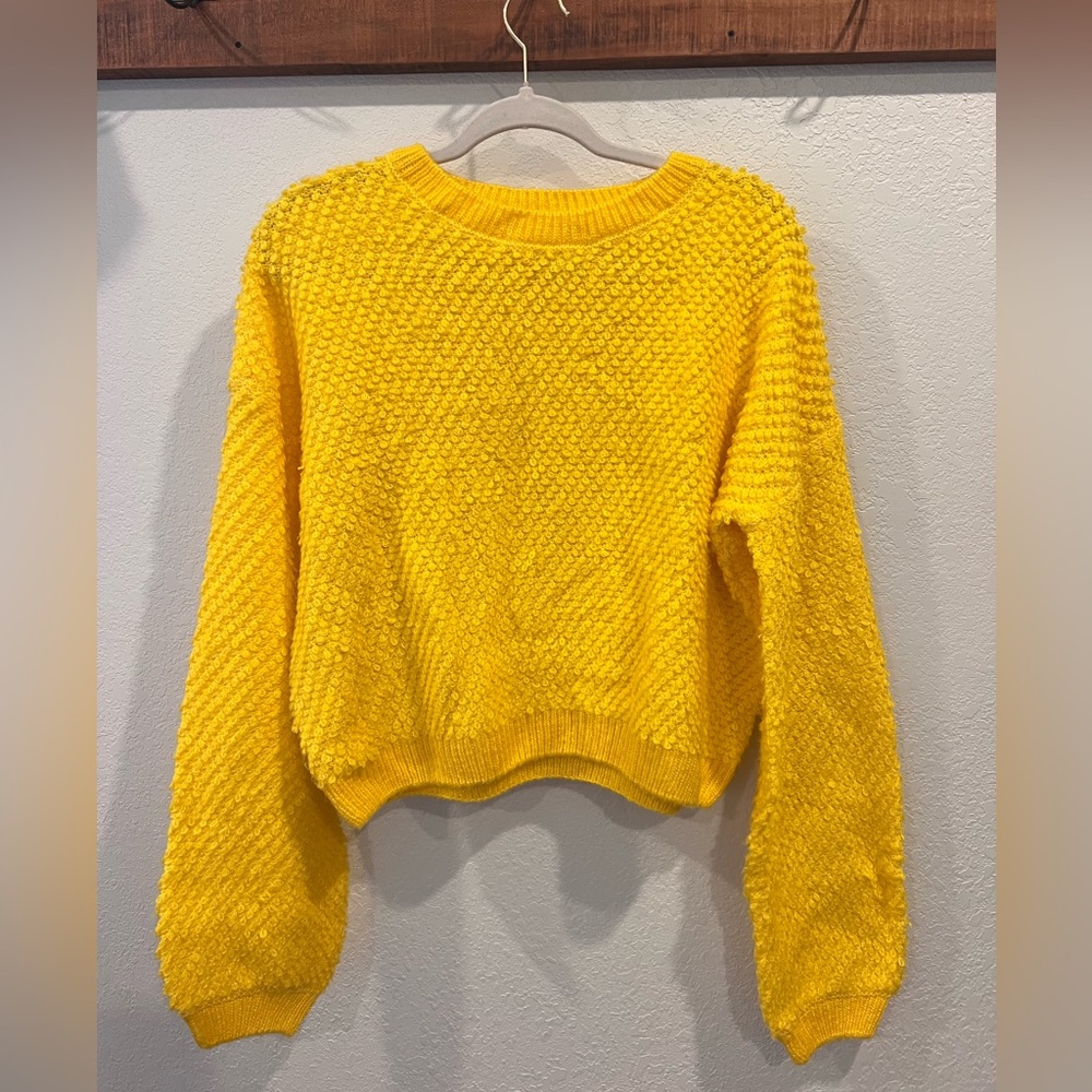Belle du jour, yellow sweater.